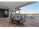 Stunning outdoor dining area with a pool and lake view, perfect for entertaining guests at 1702 4Th St E E St, Palmetto, FL 34221