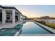 Gorgeous pool with a spa and lake views creates a relaxing backyard oasis at 1702 4Th St E E St, Palmetto, FL 34221