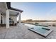 Beautiful pool and spa with an outdoor living area and serene waterfront views at 1702 4Th St E E St, Palmetto, FL 34221