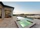 Inviting backyard with pool, spa, covered patio, and serene water views at 1702 4Th St E E St, Palmetto, FL 34221