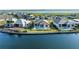 Waterfront homes showcasing private pools and landscaping along a peaceful canal at 1702 4Th St E E St, Palmetto, FL 34221