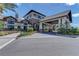 An exterior shot of a building with a porte cochere and beautiful landscaping at 17228 Corinna Pl, Bradenton, FL 34202