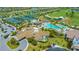 Aerial view showcases the community clubhouse, pool, and tennis courts at 17510 Gawthrop Dr # 305, Bradenton, FL 34211