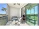 Inviting screened balcony with seating and view of the golf course at 17510 Gawthrop Dr # 305, Bradenton, FL 34211