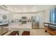 Updated kitchen with stainless steel appliances, quartz countertops, and island seating at 17510 Gawthrop Dr # 305, Bradenton, FL 34211