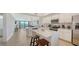 Open concept kitchen with stainless steel appliances, breakfast bar, and seamless flow to living areas at 17510 Gawthrop Dr # 305, Bradenton, FL 34211