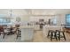 Open kitchen featuring island with seating, stainless steel appliances, and tile flooring at 17510 Gawthrop Dr # 305, Bradenton, FL 34211