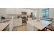 Modern kitchen featuring stainless steel appliances, light countertops, and tile flooring at 17510 Gawthrop Dr # 305, Bradenton, FL 34211