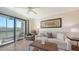 Relaxing living room with comfortable seating and balcony access at 17510 Gawthrop Dr # 305, Bradenton, FL 34211
