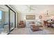 Bright living room and dining area with balcony and natural light at 17510 Gawthrop Dr # 305, Bradenton, FL 34211