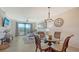 Cozy living room/dining room area with sliding doors and golf course view at 17510 Gawthrop Dr # 305, Bradenton, FL 34211