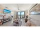 Bright living room with balcony access and cozy decor at 17510 Gawthrop Dr # 305, Bradenton, FL 34211