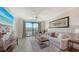 Comfortable living room with plush seating and view of the balcony at 17510 Gawthrop Dr # 305, Bradenton, FL 34211