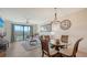 Inviting living room with comfortable seating and sliding glass doors to balcony with scenic views at 17510 Gawthrop Dr # 305, Bradenton, FL 34211