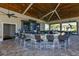 Well-appointed outdoor bar area with ample seating, modern appliances, and stylish décor for entertaining guests at 17510 Gawthrop Dr # 305, Bradenton, FL 34211