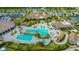 Aerial view shows an amazing pool with a walkover, lounge chairs, and a pool at 17510 Gawthrop Dr # 305, Bradenton, FL 34211