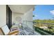 Relaxing balcony with outdoor seating, privacy, and serene views at 1800 Benjamin Franklin Dr # B308, Sarasota, FL 34236