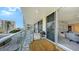 Condo balcony with seating and barbecue offers expansive views and direct access to the living area at 1800 Benjamin Franklin Dr # B308, Sarasota, FL 34236