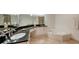 Luxurious bathroom with dual sinks, granite countertops, a vanity, and a whirlpool tub at 1800 Benjamin Franklin Dr # B308, Sarasota, FL 34236