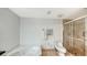 Bathroom featuring a corner soaking tub, separate shower, and tiled flooring at 1800 Benjamin Franklin Dr # B308, Sarasota, FL 34236