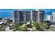 Elegant high-rise building with a beautiful beachfront location and meticulously manicured landscaping, showcasing luxurious living at 1800 Benjamin Franklin Dr # B308, Sarasota, FL 34236