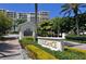 L'Elegance sign surrounded by beautiful foliage on a sunny day at 1800 Benjamin Franklin Dr # B308, Sarasota, FL 34236