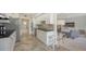 Bright, open kitchen features stainless appliances, granite countertops, and flows into the living area at 1800 Benjamin Franklin Dr # B308, Sarasota, FL 34236