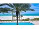 Community pool and beach with a serene and inviting scene at 1800 Benjamin Franklin Dr # B308, Sarasota, FL 34236