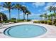 Relaxing in-ground spa surrounded by lush tropical landscaping with comfortable lounging areas and beach views at 1800 Benjamin Franklin Dr # B308, Sarasota, FL 34236