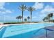 Community swimming pool and deck with beach and gulf views at 1800 Benjamin Franklin Dr # B308, Sarasota, FL 34236