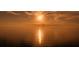Scenic sunset view over calm ocean waters, reflecting sunlight across the horizon at 1800 Benjamin Franklin Dr # B308, Sarasota, FL 34236