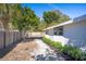 Backyard view showing the fence, yard, and side of the house, creating a private space at 2213 Wason Rd, Sarasota, FL 34231