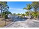Spacious backyard with fence, features patio, garden area and mature trees at 2213 Wason Rd, Sarasota, FL 34231