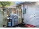 Backyard setup features a grill, wooden fence, and access door, creating an outdoor cooking space at 2213 Wason Rd, Sarasota, FL 34231
