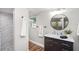 Bathroom boasts a sleek vanity with marble countertop and modern shower with tile at 2213 Wason Rd, Sarasota, FL 34231