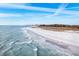 Scenic beach with gentle waves and light sand, perfect for leisurely strolls at 2213 Wason Rd, Sarasota, FL 34231