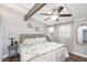 Charming bedroom showcases a cozy bed with decorative pillows and nautical-themed bicycle decor at 2213 Wason Rd, Sarasota, FL 34231