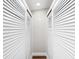 Closet featuring white doors that conceal storage space for enhanced functionality at 2213 Wason Rd, Sarasota, FL 34231