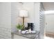 Cozy coffee station with granite countertop, brick wall, lamp, coffee maker, and a tray for a welcoming setup at 2213 Wason Rd, Sarasota, FL 34231