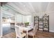Bright dining area with a stylish table setting, views of the outdoor pool, and tasteful decor at 2213 Wason Rd, Sarasota, FL 34231