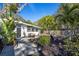 Charming home with a well-manicured yard and inviting front entrance, enhanced by mature trees for a tranquil setting at 2213 Wason Rd, Sarasota, FL 34231