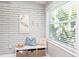 Functional entryway nook with storage and bright accents at 2213 Wason Rd, Sarasota, FL 34231