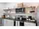 Modern kitchen with granite countertops and stainless steel appliances at 2213 Wason Rd, Sarasota, FL 34231