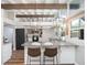 Bright kitchen with granite countertops, stainless steel appliances, and barstool seating at 2213 Wason Rd, Sarasota, FL 34231