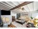 Cozy living room with beamed ceilings, a comfortable seating arrangement, and decorative accents at 2213 Wason Rd, Sarasota, FL 34231