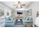 Comfortable living room with stylish furnishings, ceiling fan and coastal decor at 2213 Wason Rd, Sarasota, FL 34231