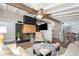 Comfortable living room showcases brick fireplace, vaulted ceilings and an open floor plan at 2213 Wason Rd, Sarasota, FL 34231