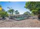 Backyard with screened-in pool, patio area and tropical landscaping at 2213 Wason Rd, Sarasota, FL 34231