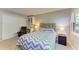 Well-lit bedroom with a closet, built-in shelving, and a large window at 2233 Beneva Ter # 2232, Sarasota, FL 34232