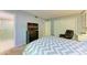 Spacious bedroom with a TV, closet, and adjacent bathroom for added convenience at 2233 Beneva Ter # 2232, Sarasota, FL 34232